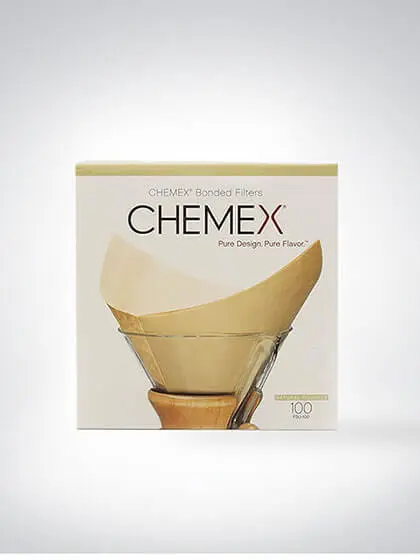 Packung Chemex Kaffeefilter mit Glaskaraffe im Hintergrund, 100 Stück