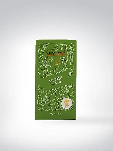 Verpackung des Sirocco Tea Piz Palü Kräutertees in Grün mit kunstvollem Design und Bio-Siegel