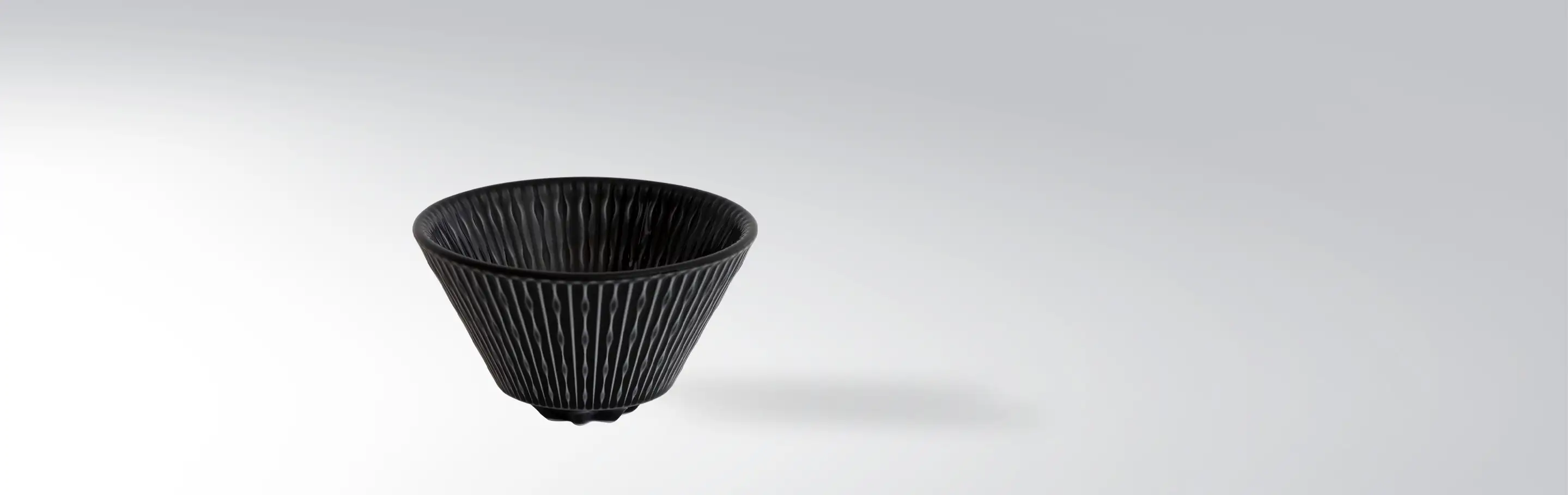 Black patterned ceramic cup