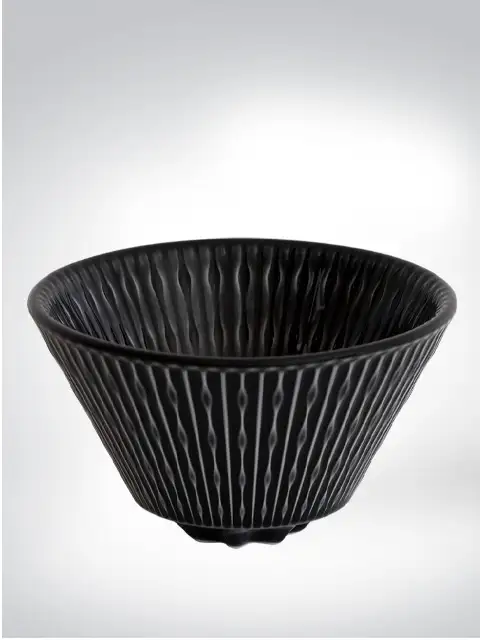 Elegant black ceramic bowl with unique grooved pattern