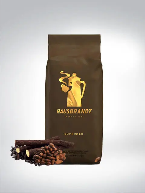 A packet of Hausbrandt Superbar Coffee with coffee beans and chocolate pieces in the foreground