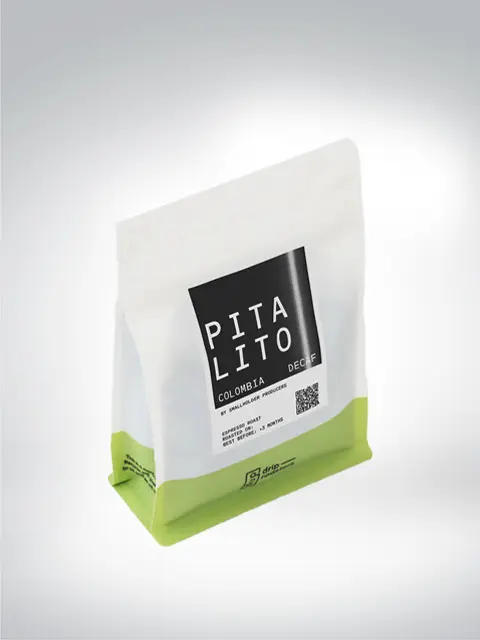 White and green pack of Pitalito coffee, decaffeinated, from Colombia