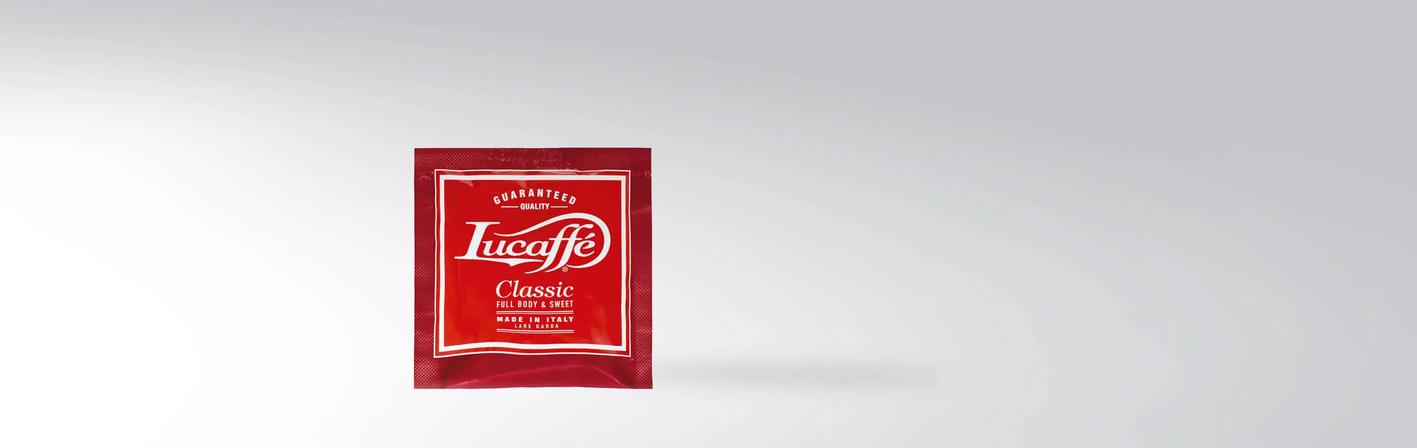 Red pack of Lucaffè Classic coffee pads