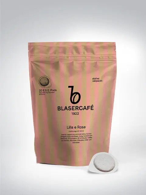 Produktbild von Blasercafé E.S.E. Pads Lilla e Rose, 20 umweltfreundlich verpackte Kaffee-Pads in einer gestreiften, rosa Verpackung.