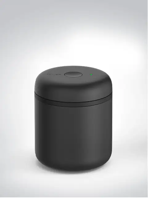 Black, cylindrical air purifier with a smooth surface and LED indicator