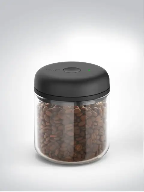 Modern coffee storage container with black lid filled with coffee beans.