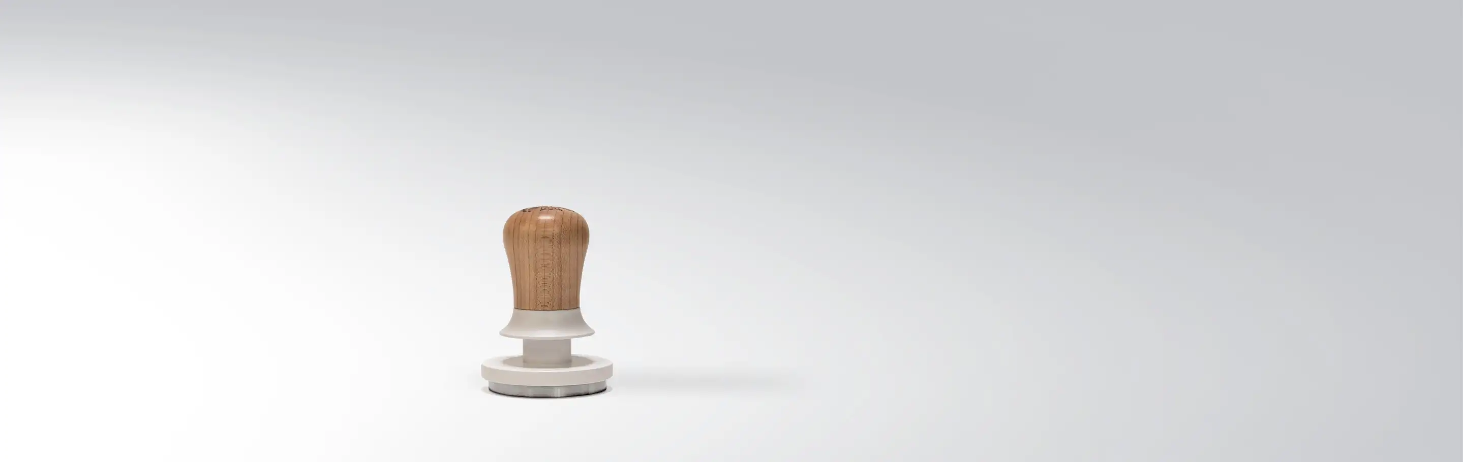 Wood coffee tamper on a white background, suitable for espresso making