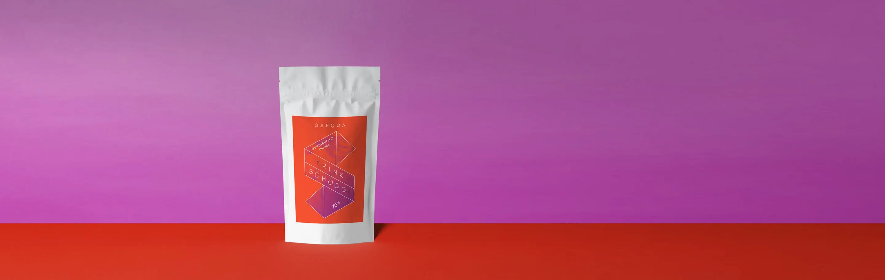 A drinking chocolate package with modern design against a colourful background.